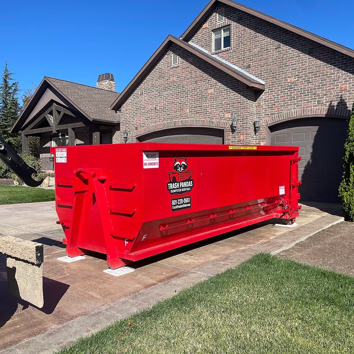 Trash Pandas Utah 20-yard dumpster set on a Holladay driveway